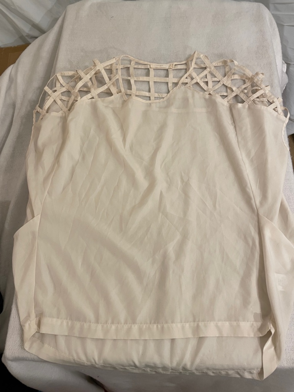 Lush Cream Sleeveless Top with Lattice Yoke
